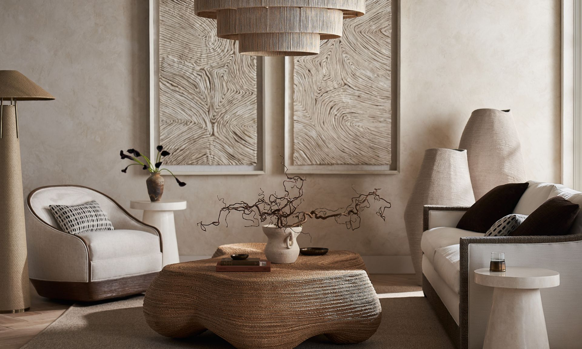 Organic Modern living room featuring a sculptural coffee table, textured upholstery, neutral tones, and layered natural materials.