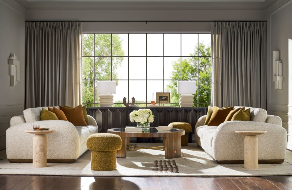 Warm Contemporary living room blending sculptural forms, rich textures, warm wood finishes, and elevated modern comfort.